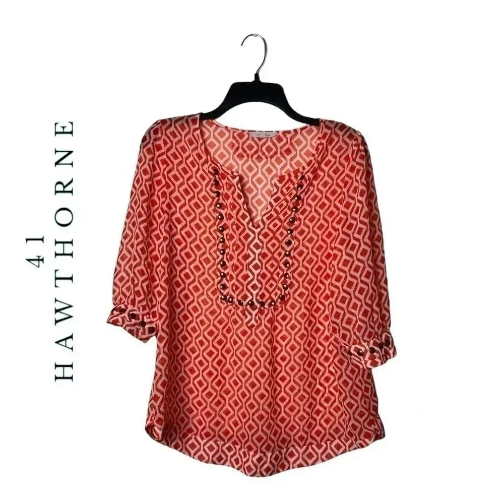 1473. 41 HAWTHORN 3/4 SLEEVE SHEER TOP ORANGE/WHITE IN COLOR GEOMETRICAL SHAPE